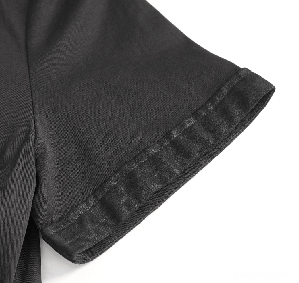 Short sleeve cuff detail of black gothic punk shirt with imitation leather rolled trim and woven fabric texture