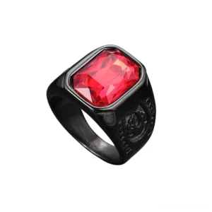 Side profile of black gothic ring with square red glass gem, polished band with engraved shoulder details