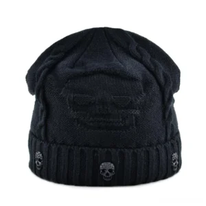 Black gothic skull knitted beanie with metal embellished skull badge, ribbed cuff, and cable knit texture - top-down view