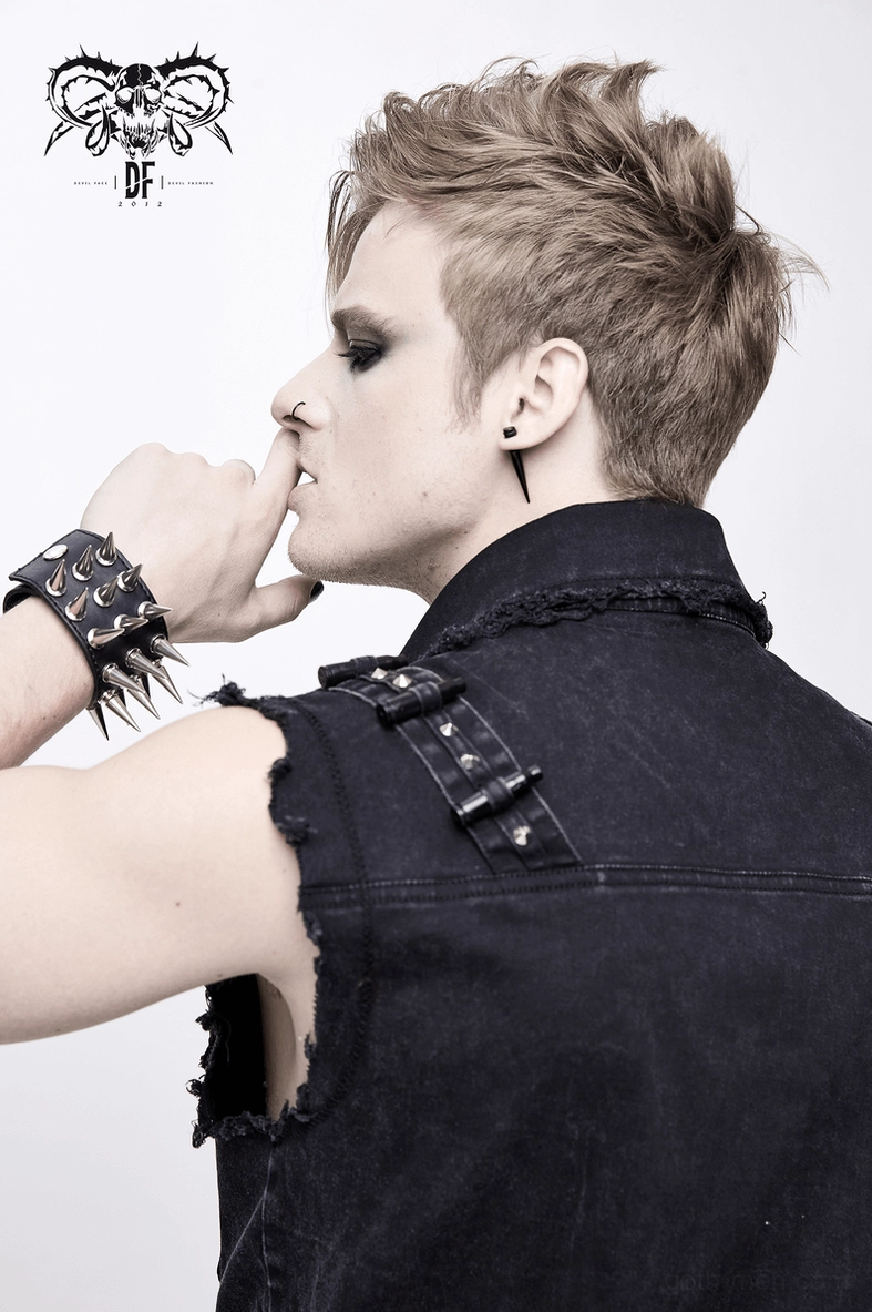 Black gothic denim sleeveless vest on model with complete alternative outfit pairing
