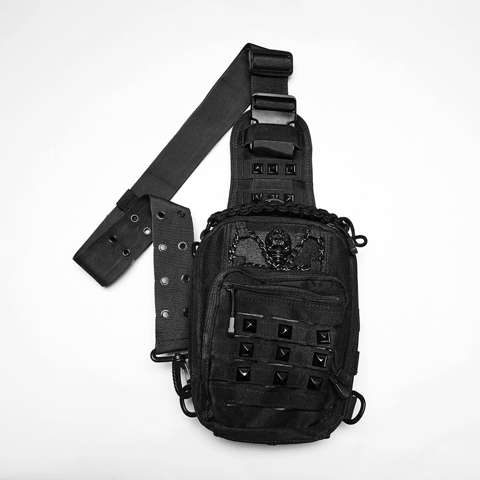 Flat lay of black gothic crossbody backpack showing chain trim and multi-zippered pockets