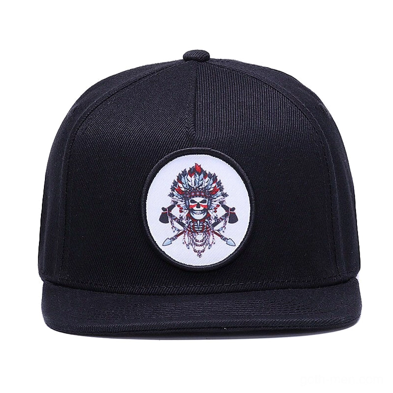 Black gothic snapback baseball cap direct front view showing round native skull embroidered motif and twill fabric texture