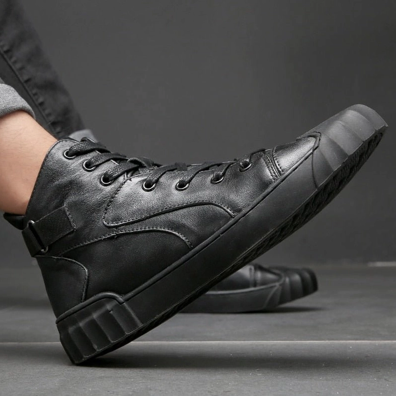 Black high-top genuine leather gothic sneaker showing shell toe cap and textured outsole pattern