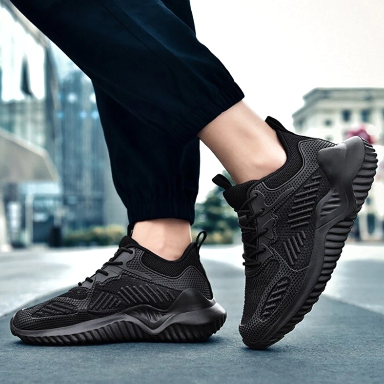 Black sports mesh sneaker street styling with track pants - alternative minimalist goth