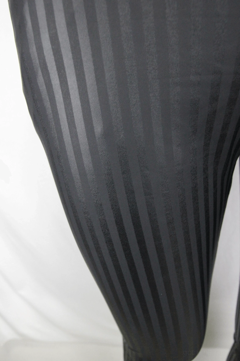 Fabric close-up showing black glossy vertical stripe texture and sheen gothic trousers