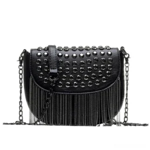 Black gothic studded shoulder bag with chain strap and tassel fringe trim, front flat lay view showing metal rivets and leather texture