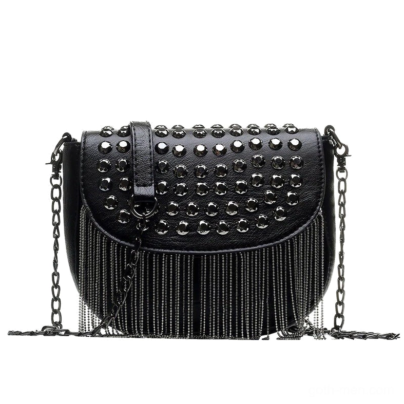 Black gothic studded shoulder bag with chain strap and tassel fringe trim, front flat lay view showing metal rivets and leather texture