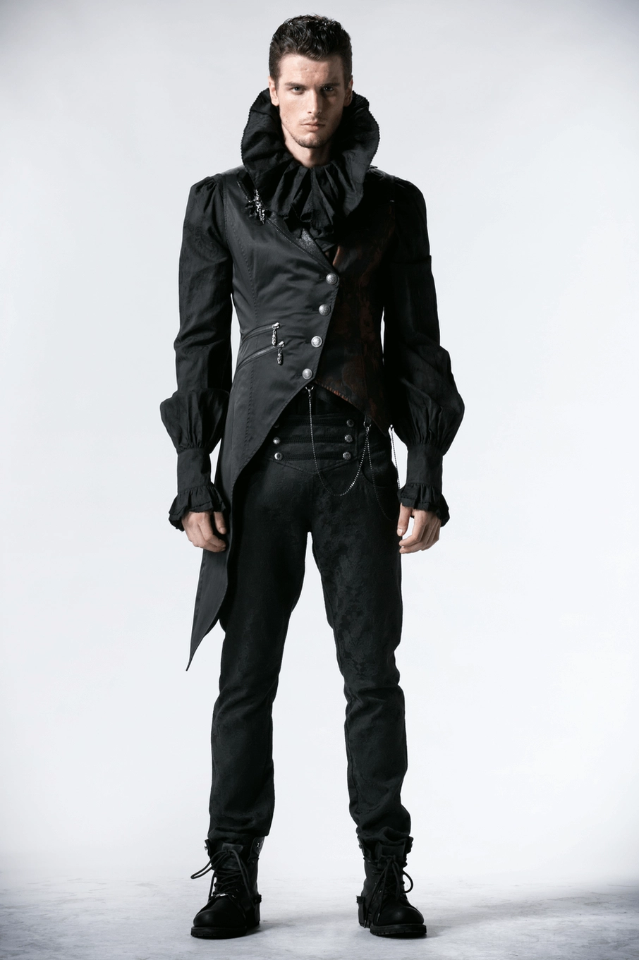 Full-length black gothic tailcoat vest with ornate silver chains, crimson red brocade accents, and asymmetrical hem design