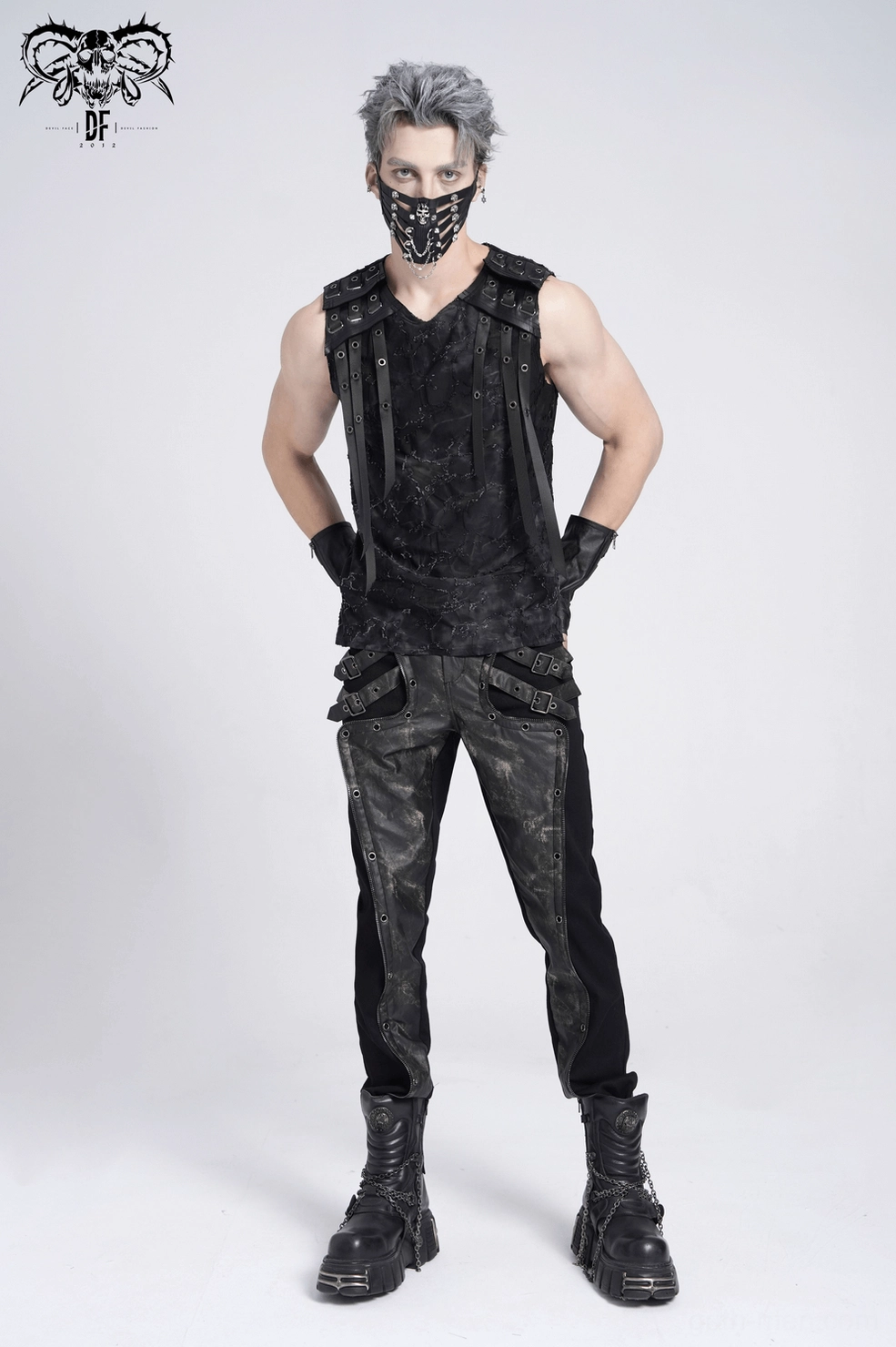 Distressed black gothic tank top showing faux leather rivet strap details and fabric destruction