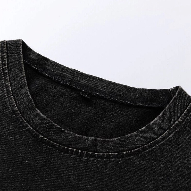 Close-up detail of ribbed crew neck trim on black gothic tank top showing quality stitching and faded cotton fabric