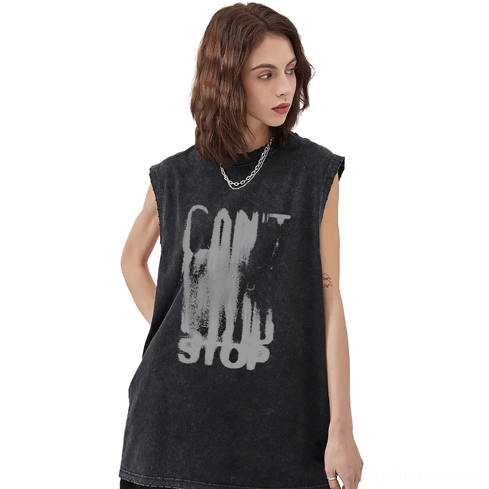 Female model wearing black gothic tank top with distressed letter graphic print, left three-quarter view showcasing vintage alternative streetwear style