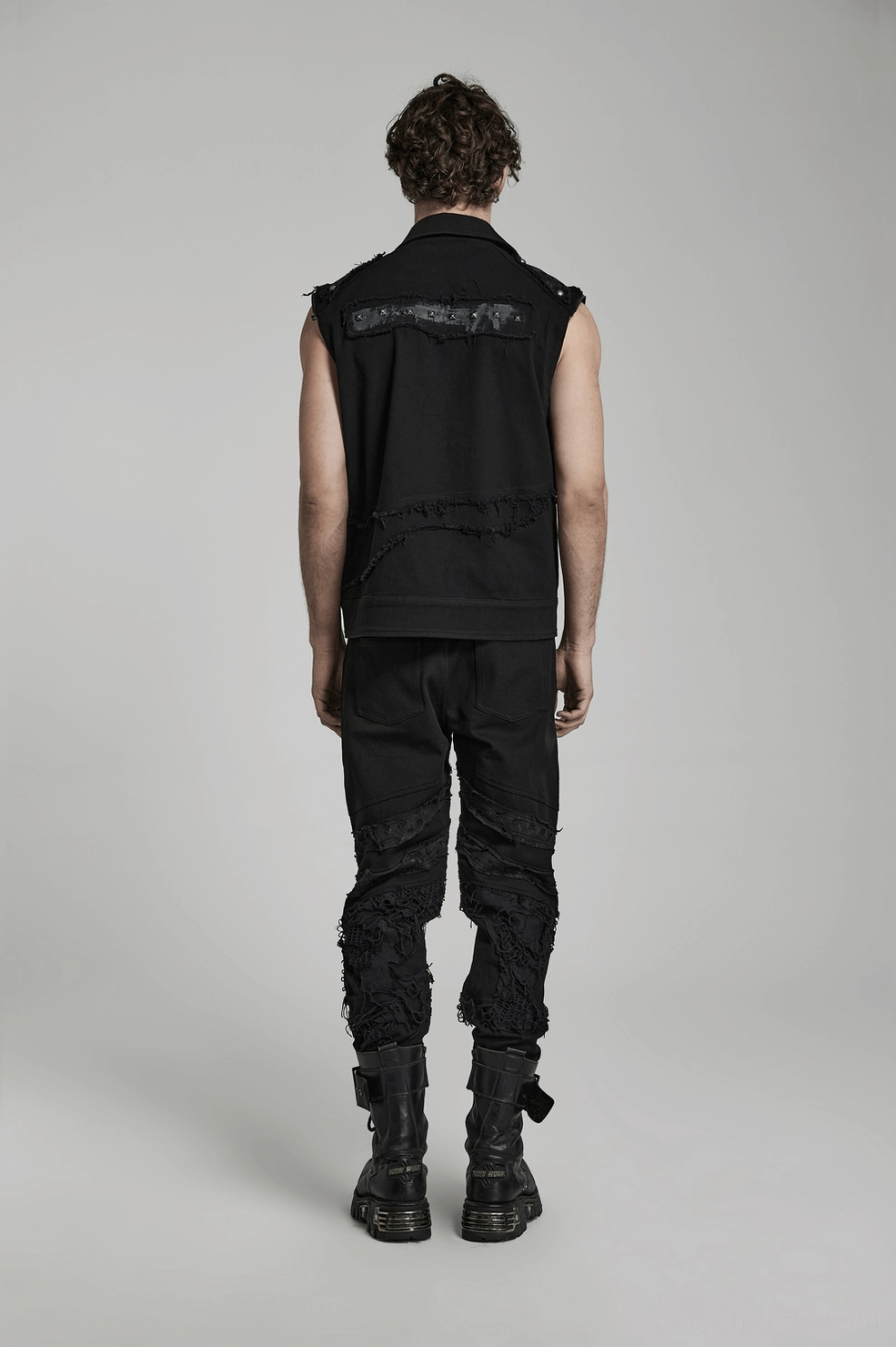 Black distressed knit gothic trousers overall construction showing multiple distressed areas