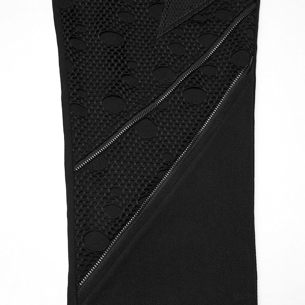 Front close-up of black gothic pants perforated mesh and zipper trim details