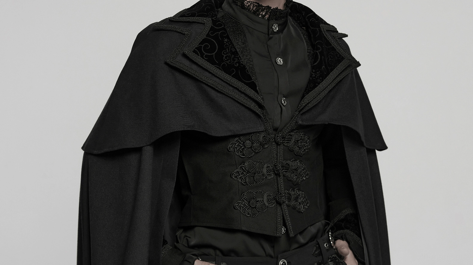 Black gothic vampire cloak showing intricate embroidered velvet panel details and theatrical collar construction