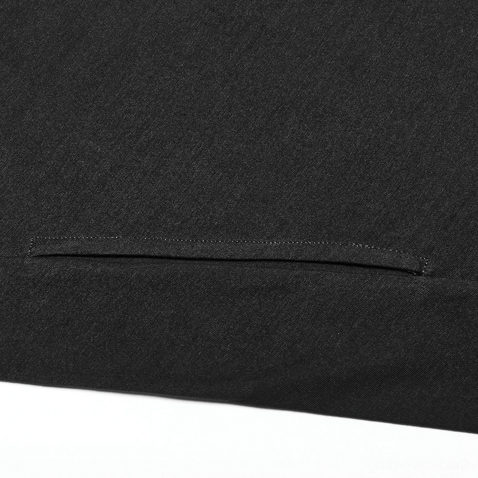 Close-up texture detail of black gothic knit fabric with soft cowl neckline
