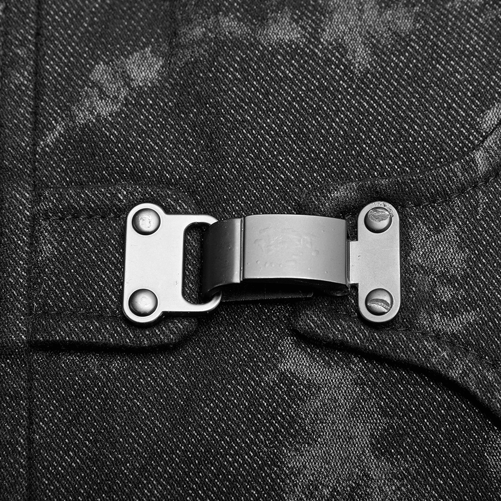 Black gothic mens vest front buckle close-up macro - silver metal buckle with reinforced stitching on textured fabric