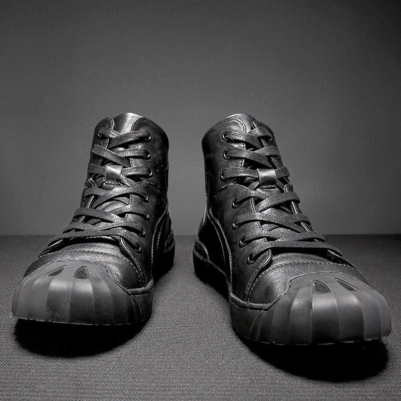 Pair of black leather high-top gothic sneakers front view with shell toe design and full lace-up closure