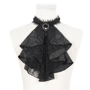Black lace jabot choker with ruffled layers and ornate gemstone brooch displayed on white dress form, front close-up detail