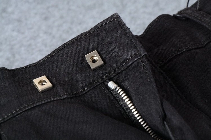 Black denim jeans snap fastener detail - metal square buttons on waistband