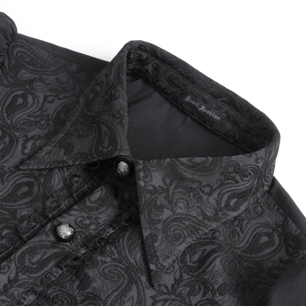 Close-up detail of black gothic shirt collar showing paisley jacquard fabric and metallic buttons
