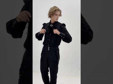 Gothic formal black lace shirt styled with collar brooch on male model in fitted tailored silhouette