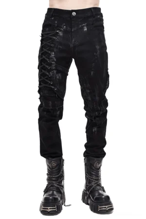 Black gothic slim-fit pants with lace-up detail on right leg, front view on male model wearing distressed trousers