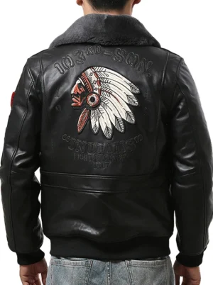 Black sheepskin bomber jacket back view featuring large Indian chief embroidery artwork and military insignias