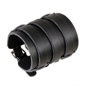Black genuine leather gothic wide cuff bracelet with multi-strap adjustable buckle design, side oblique view on white background