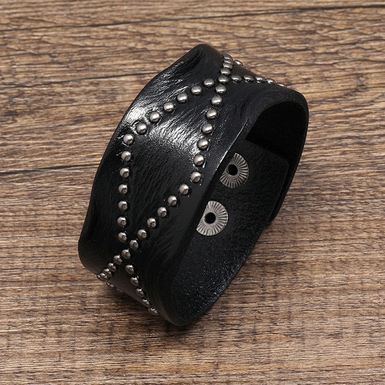 Black leather gothic cuff bracelet side view demonstrating width and rivet craftsmanship detail
