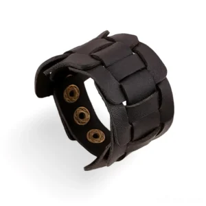 Black woven leather gothic cuff bracelet with brass snap fasteners, close-up detail shot showing inner adjustment straps