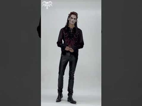 Gothic male model wearing black synthetic leather pants with dark red blouse alternative fashion styling