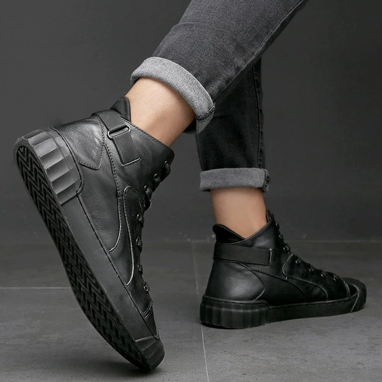 Black genuine leather high-top gothic sneaker bottom view showing ridged rubber sole and grip pattern
