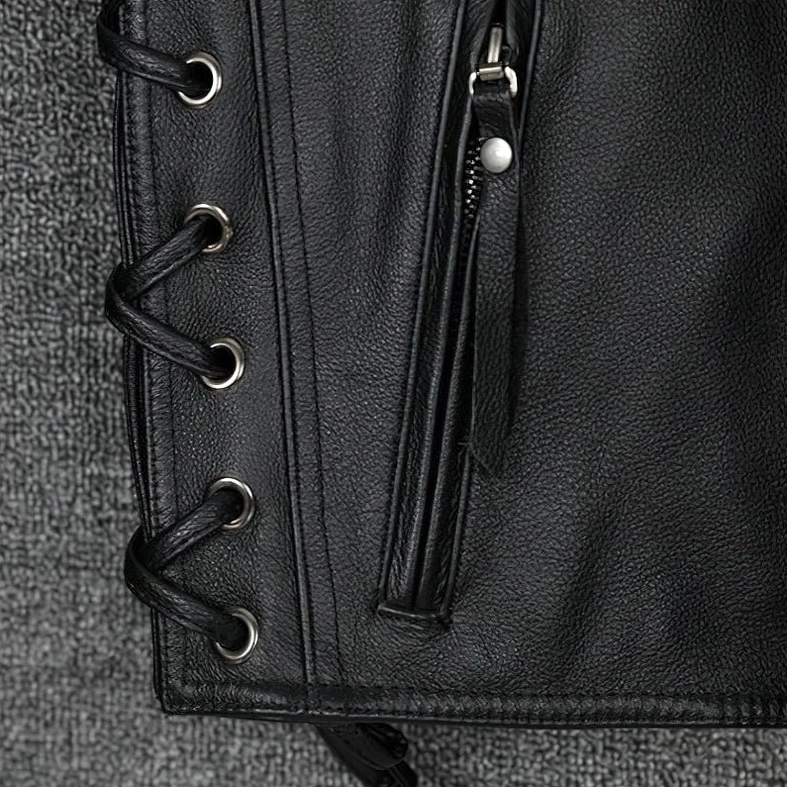 Side lace-up panels and zipper pocket on black genuine leather gothic waistcoat, showing braided laces and side zipper detail