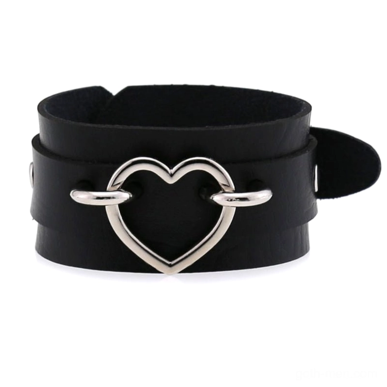 Black double-layer leather heart cuff bracelet with silver heart metal decoration and adjustable strap, front flat lay gothic