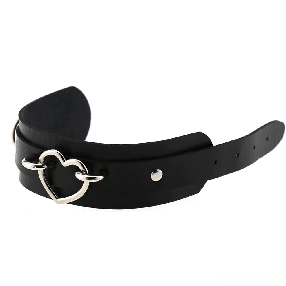Black single-layer leather heart cuff bracelet with small silver hollow heart buckle showing adjustable strap holes, side view gothic