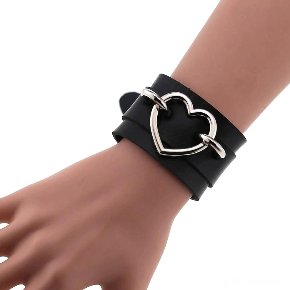 Black leather double-layer heart cuff bracelet with hollow iron heart buckle on mannequin wrist, side close-up view gothic bracelet