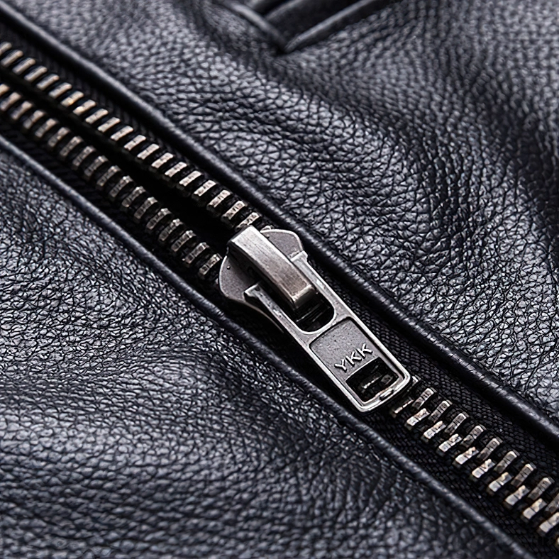 YKK metal zipper hardware detail on black calfskin leather motorcycle jacket