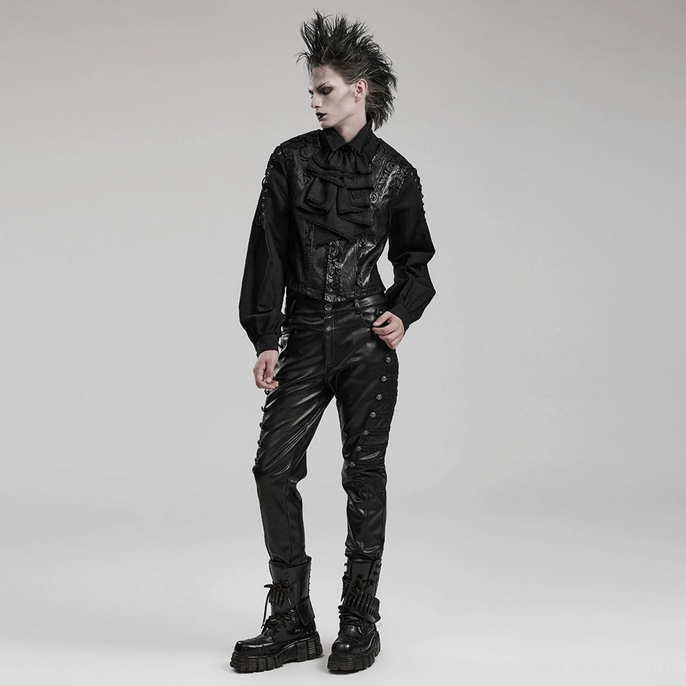 Full-length view of black studded gothic leather pants on model with side-button thigh embellishments and decorative webbing