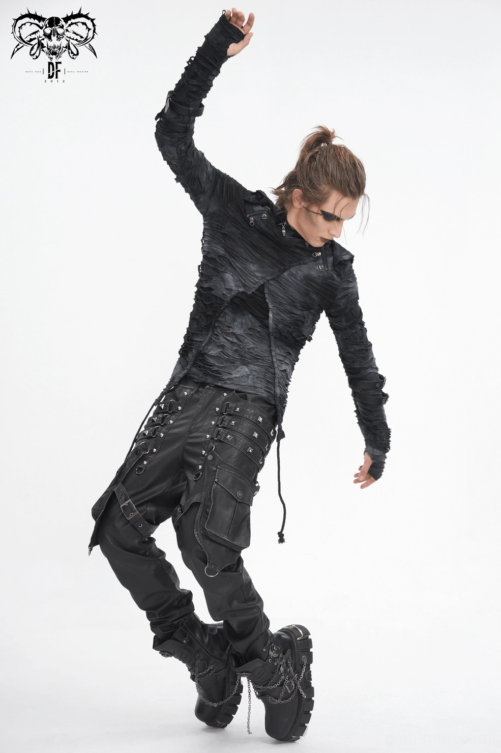 Side view of black leather pants showcasing leg harness straps, utility pocket placement, metal hardware, and industrial silhouette