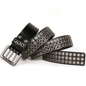 Black studded leather belt flat lay oblique view showing dual grommet strap ends and double-prong buckle