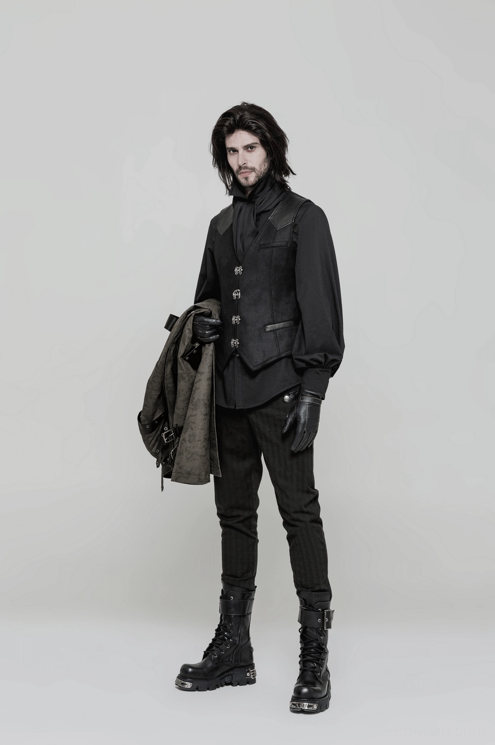 Black matte gothic waistcoat showing industrial metal accents and alternative fashion styling