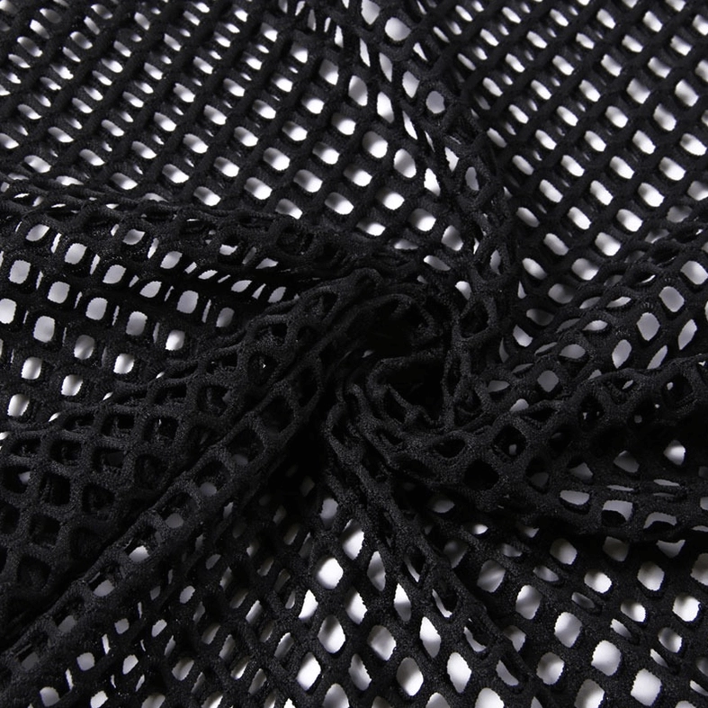 Crinkled black fishnet fabric close-up showing stretchy mesh weave and transparency