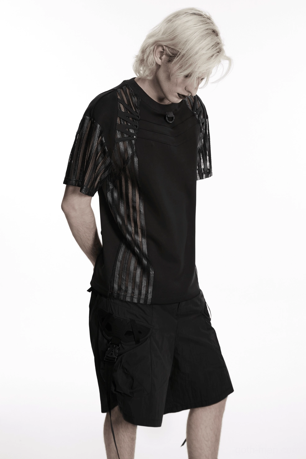 Black mesh cage tactical gothic t-shirt close-up of chest area featuring D-ring hardware and mesh panel integration