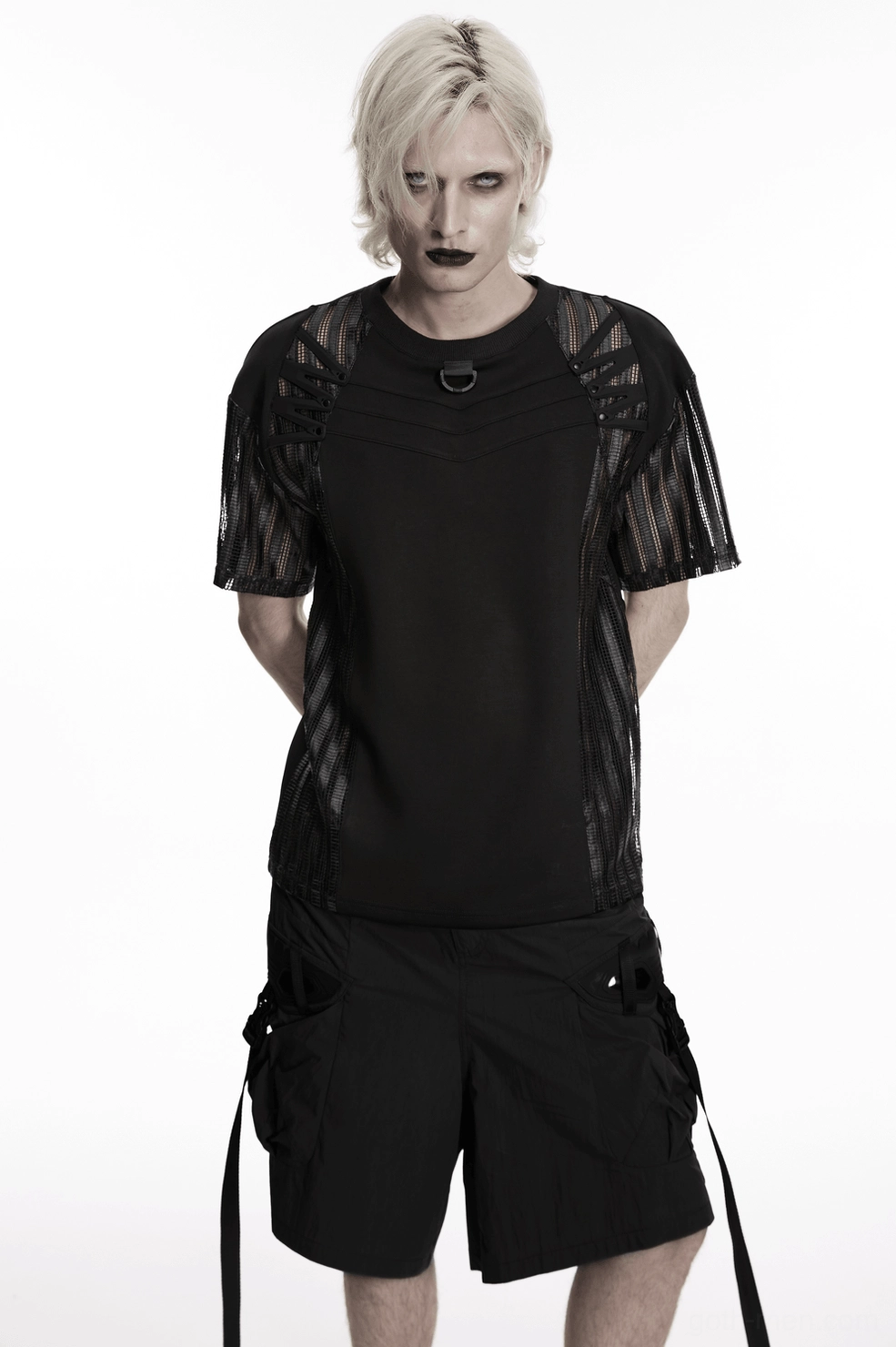 Black tactical gothic mesh t-shirt styled on male model showing overall silhouette with mesh sleeves and hardware elements