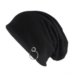 Black metal hoop gothic slouch beanie with dual silver ornaments, front-side oblique view