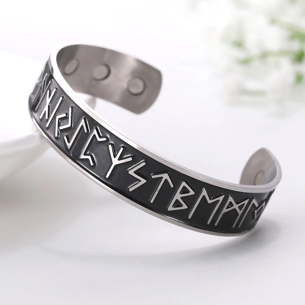 Black base stainless steel Nordic rune magnetic cuff bracelet with silver embossed runes, flat side view
