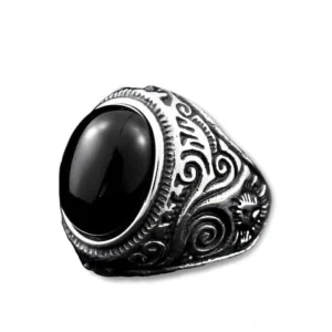 Black onyx gothic ring with stainless steel bezel setting, polished gemstone, flat product photography