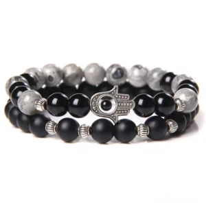 Black onyx beaded gothic bracelet with gray marble accents and silver Hamsa charm - Style 1 flat lay