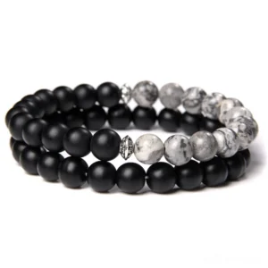 Black onyx and grey mapstone dual-layer beaded gothic bracelet with silver spacers, elastic construction, flat lay overhead view