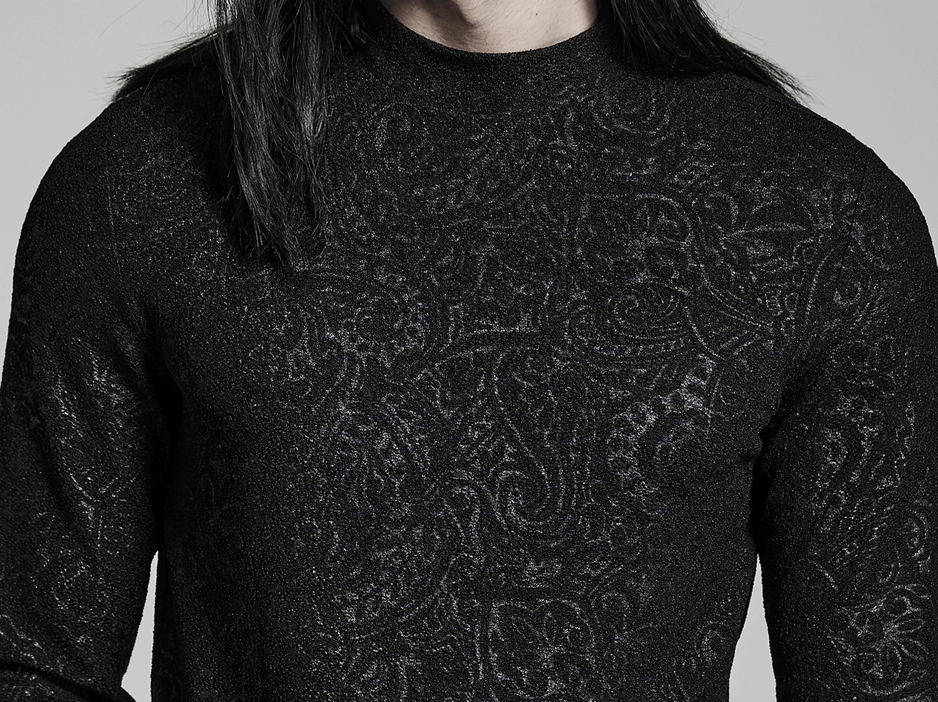 Close-up detail of black paisley jacquard fabric and mock turtleneck collar on gothic slim top